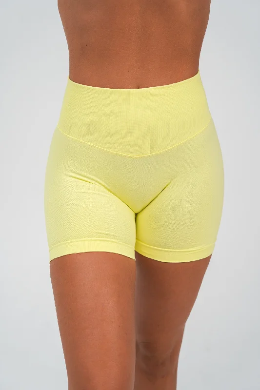 Button-front shorts – Shorts with a button-up closure at the front for a chic, stylish detail.RECOIL HIGH WAIST SCRUNCH SHORTS - LEMON