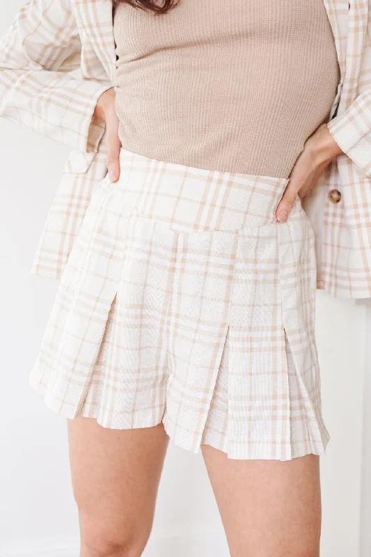 Culottes – Wide-legged, knee-length or mid-calf shorts that resemble a skirt but are more comfortable and practical.Dressed in Plaid Shorts