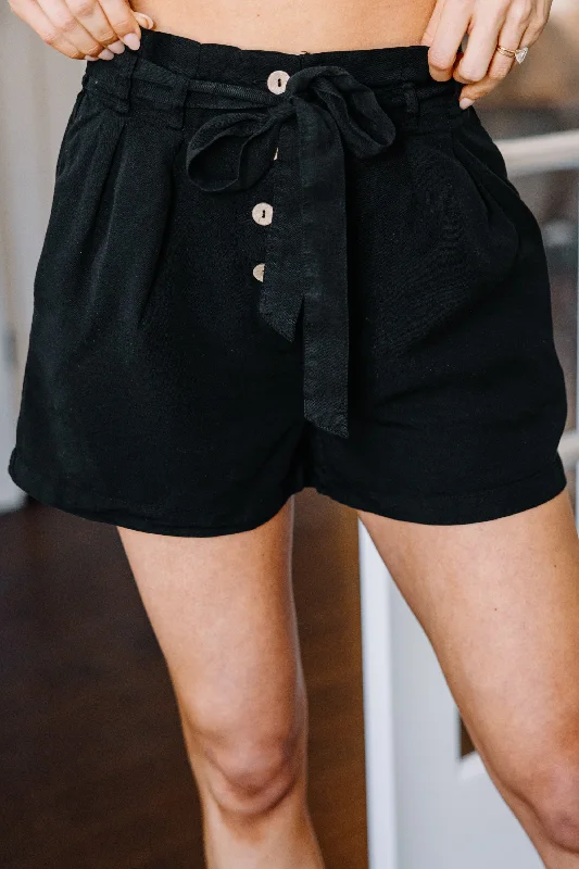 Pleated shorts – Shorts with pleats at the waist for extra volume or texture, creating a more sophisticated appearance.All For You Black Paperbag Shorts