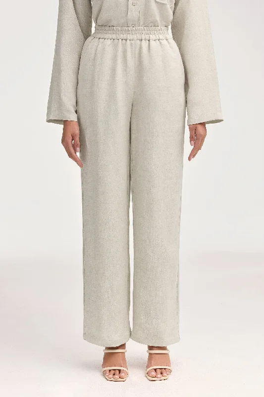 Pleated trousers – Trousers with folds or pleats in the front, often adding volume or texture to the garment.Adalila Linen Wide Leg Pants - Oatmeal