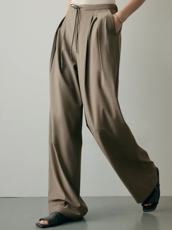 Button-front trousers – Trousers that feature a row of buttons along the waistband for a stylish detail.BerryBetty - Always Neutral Pleat Wide Leg Pants