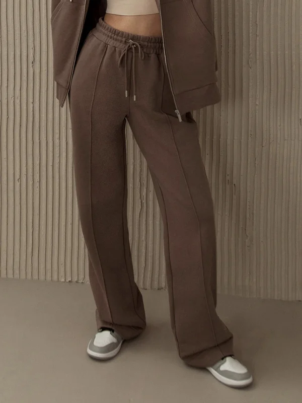 Cargo trousers – Loose-fitting trousers with large pockets on the sides, often made from durable materials.BerryBetty - Brownie Drawstring Sweatpants