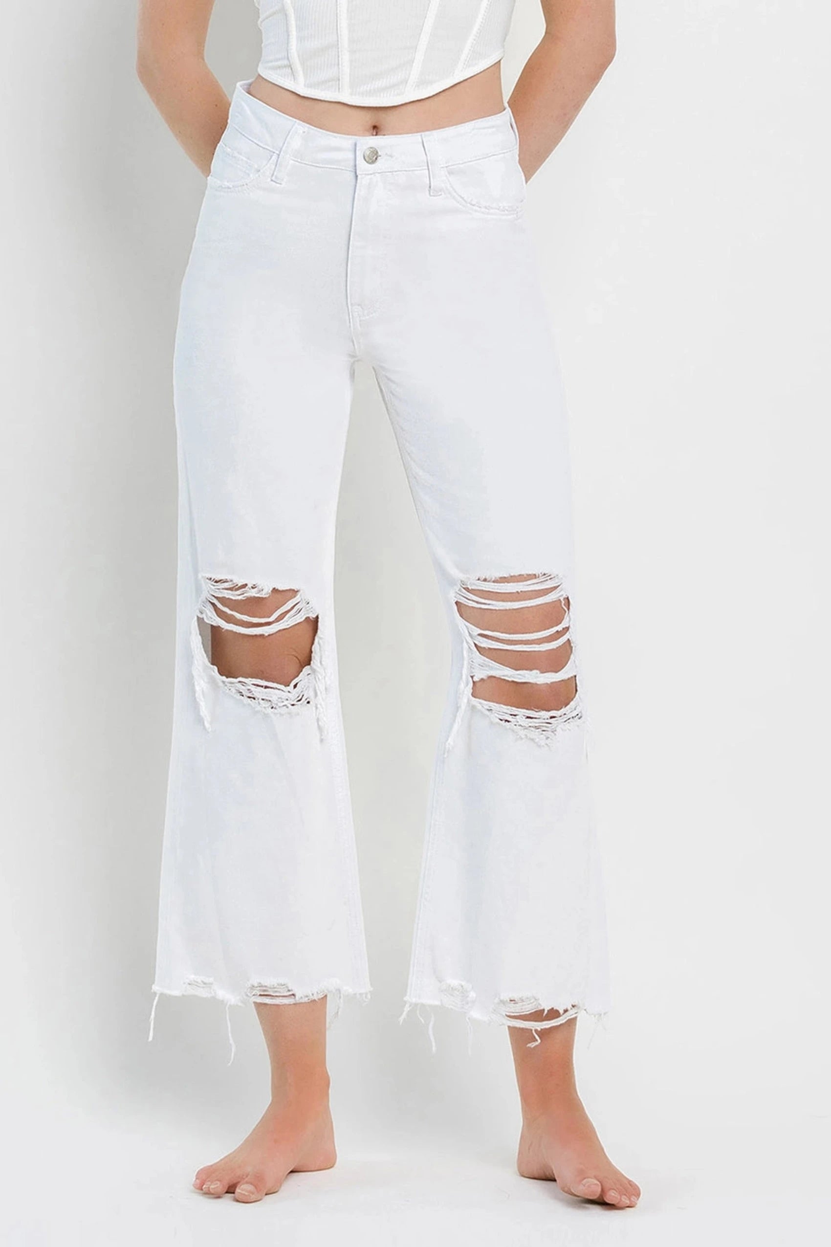 Wide-leg trousers – Trousers with a loose, flared fit from the hips down to the ankles.Channing 90's Distressed Crop Flare Jeans - White