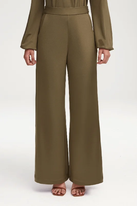 Flared trousers – Trousers with a gradual flare from the knee down, often associated with retro or 1970s fashion.Fatima Everyday Wide Leg Jersey Pants - Olive