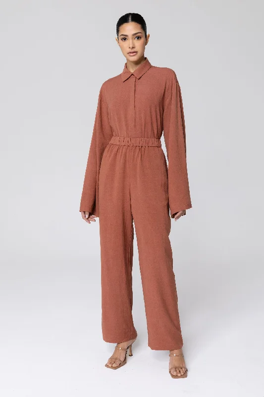 Palazzo trousers – Wide-leg trousers made from light, flowy fabric, often associated with a chic or bohemian look.Gemma Linen Wide Leg Pants - Baked Clay