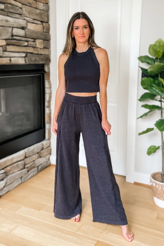 Palazzo trousers – Wide-leg trousers made from light, flowy fabric, often associated with a chic or bohemian look.On The Go Lounge Set - Charcoal