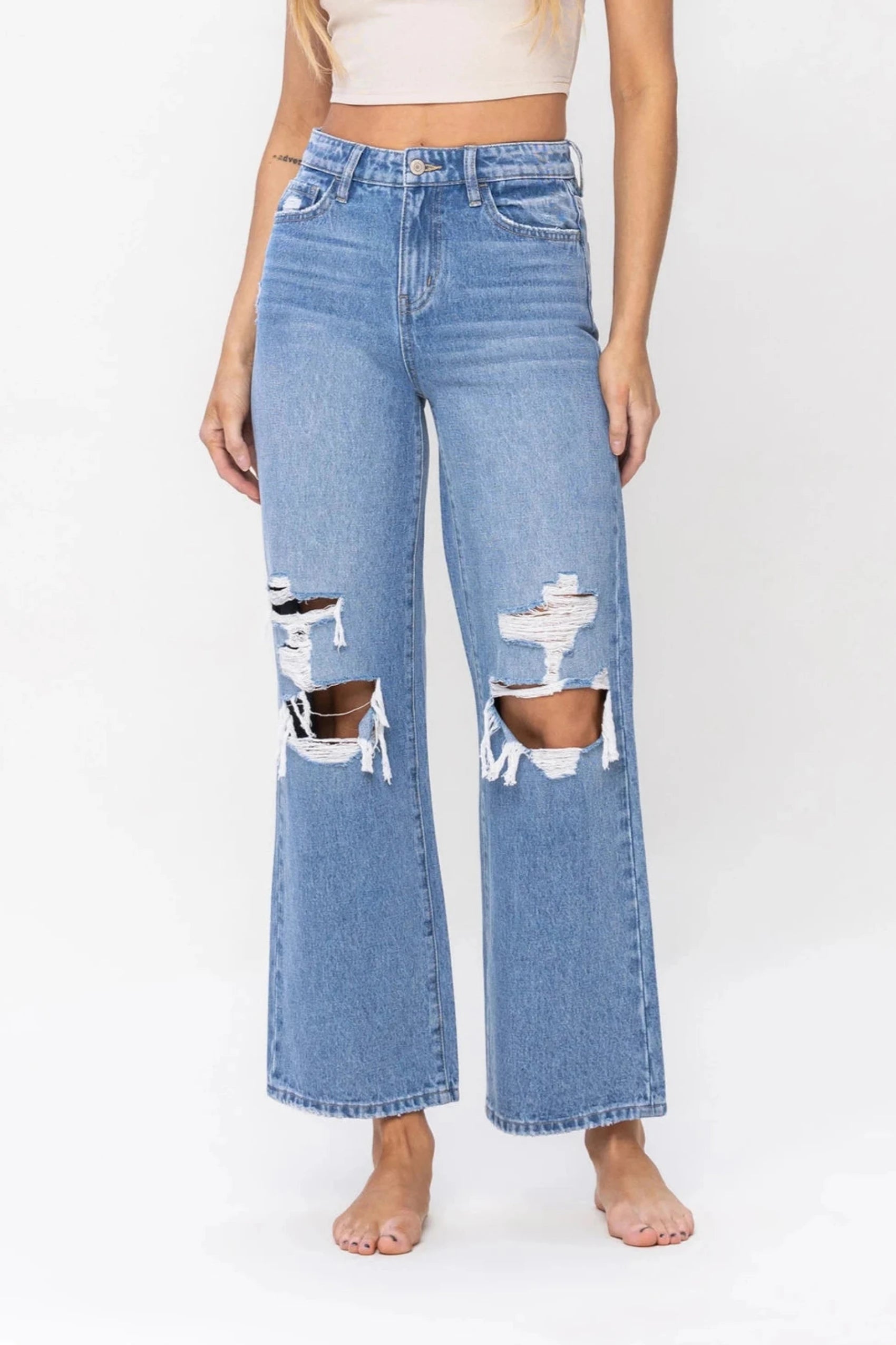 Denim trousers – Made from denim fabric, often resembling jeans but styled as more formal trousers.Kelly High Rise Distressed Wide Leg Jeans