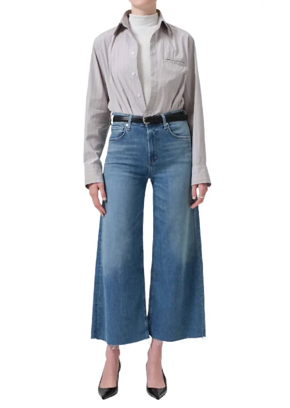 Cargo trousers – Loose-fitting trousers with large pockets on the sides, often made from durable materials.Lyra Crop Wide Leg Jean In Abliss