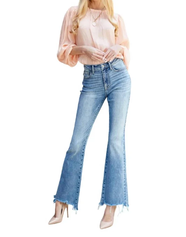 Flared trousers – Trousers with a gradual flare from the knee down, often associated with retro or 1970s fashion.Mid Rise Boot Cut Jeans In Medium