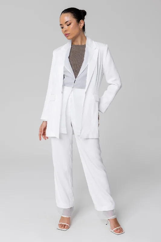 Tapered trousers – Trousers that narrow toward the ankle, creating a more fitted, streamlined look.Rayan Organza Trim Trousers - White