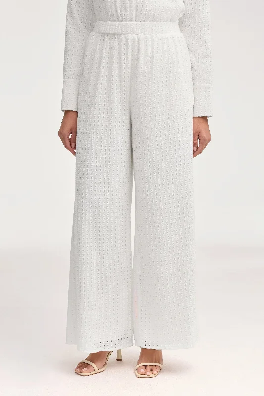 High-waisted trousers – Trousers that sit above the waistline for a flattering, elongating look.Sadie White Eyelet Wide Leg Pants