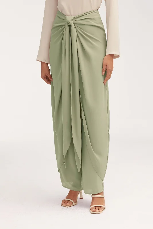 Pleated trousers – Trousers with folds or pleats in the front, often adding volume or texture to the garment.Sarong Skirt & Pants Two Piece Set