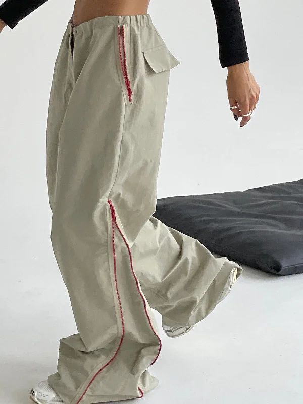 Pleated trousers – Trousers with folds or pleats in the front, often adding volume or texture to the garment.BerryBetty - Side Zippered Cargo Pants