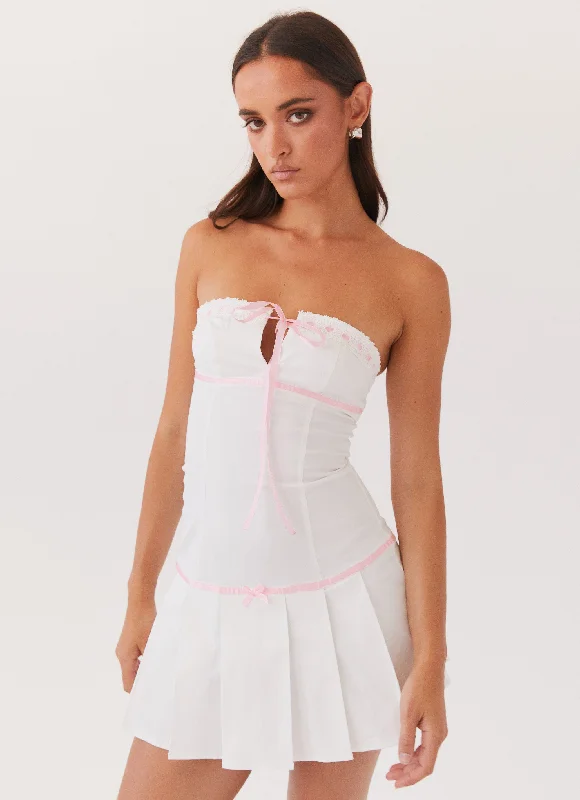 Mini skirt – Very short skirt, typically above the knee.Candy Coated Bustier Mini Dress - Pink Ribbon