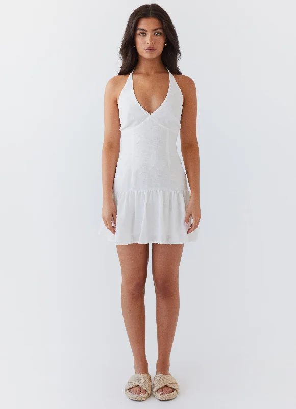 Maxi skirt – Skirt that reaches the ankles or floor, offering a long, flowing silhouette.Selena Halter Mini Dress - White