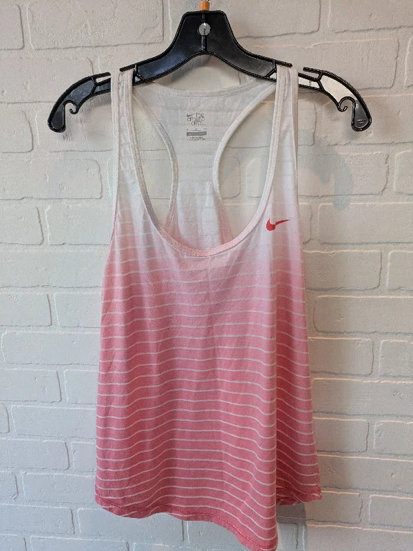 Long vest – Extended length vest, often reaching mid-thigh or kneePink & White Athletic Tank Top Nike, Size S