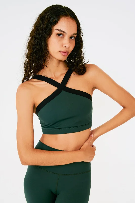 Racerback sports bra – Sports bra with a back design that features straps that meet in a "V" or "Y" shape, offering better shoulder mobility.Riley Rigor Bra