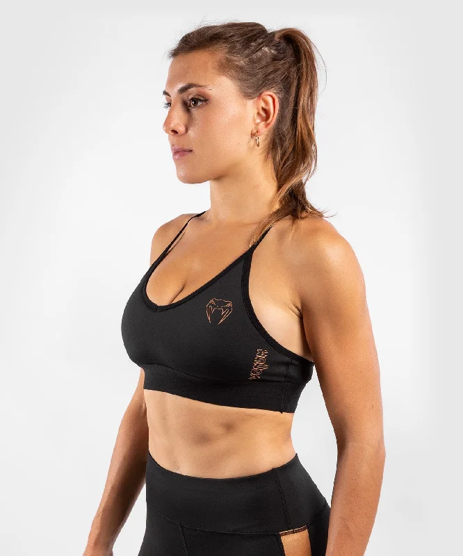 Criss-cross strap sports bra – Sports bra with straps that cross over at the back, providing extra support and a stylish look.Venum Tecmo Sport Bra - For Women - Black/Bronze